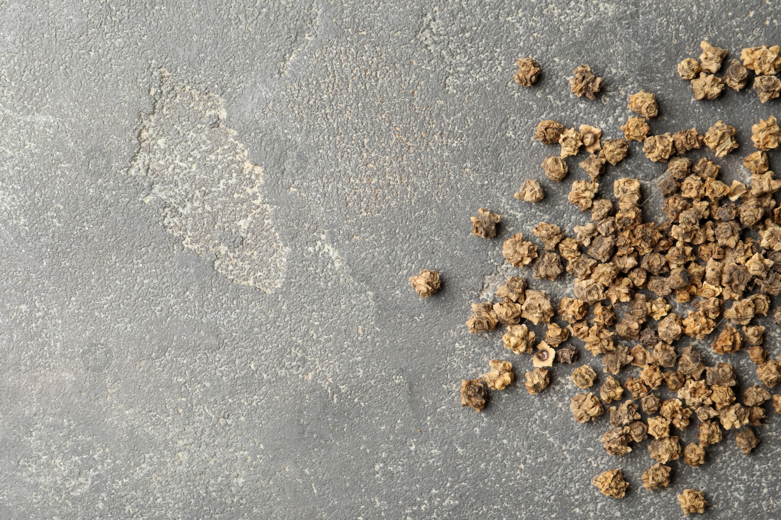 Photo of Raw beet seeds and space for text on grey background, flat lay. Vegetable planting