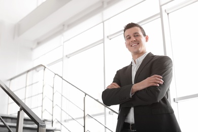 Portrait of confident businessman on stairs