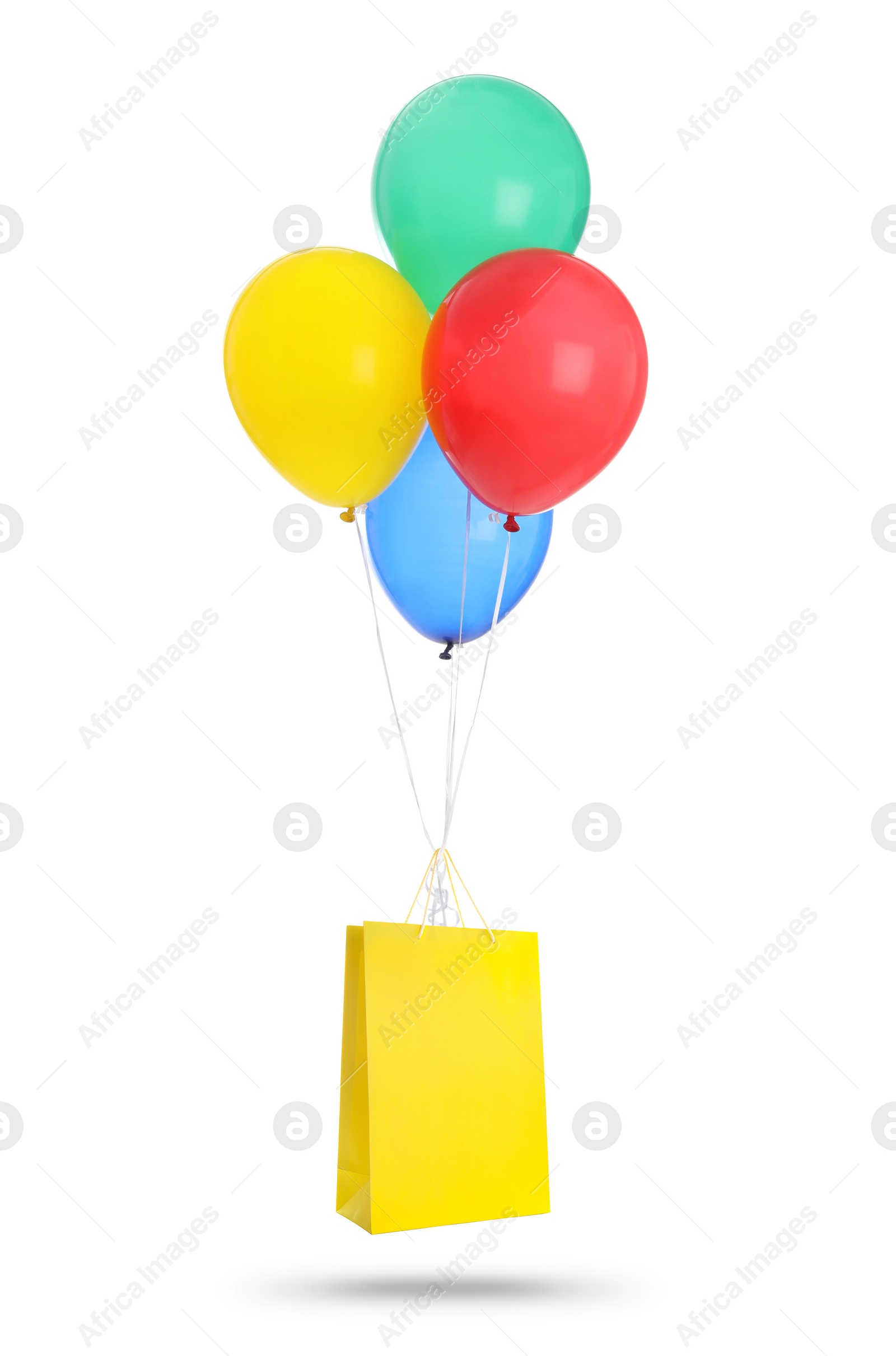 Image of Bunch of bright balloons and yellow paper bag on white background