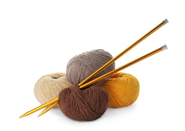Photo of Soft woolen yarns and knitting needles on white background