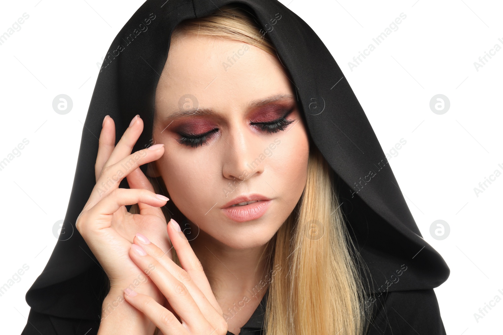 Photo of Witch in black mantle isolated on white. Scary fantasy character