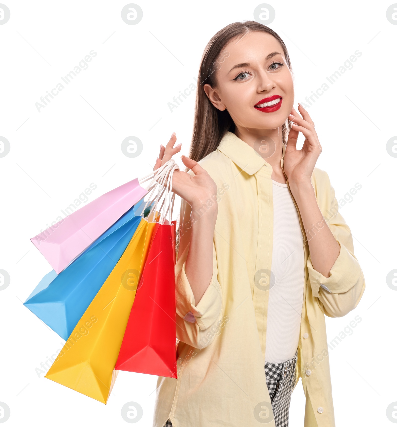 Photo of Stylish young woman with shopping bags on white background