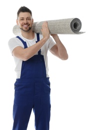 Photo of Male worker with rolled carpet on white background