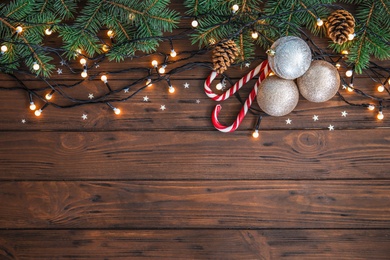 Flat lay composition with Christmas decoration on wooden background