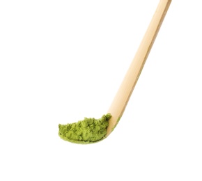 Matcha spoon with powdered green tea on white background