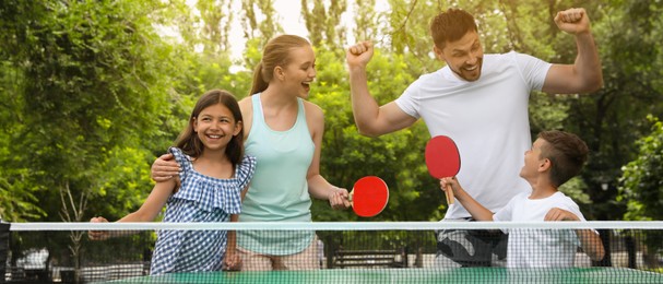 Image of Happy family playing ping pong in park. Banner design