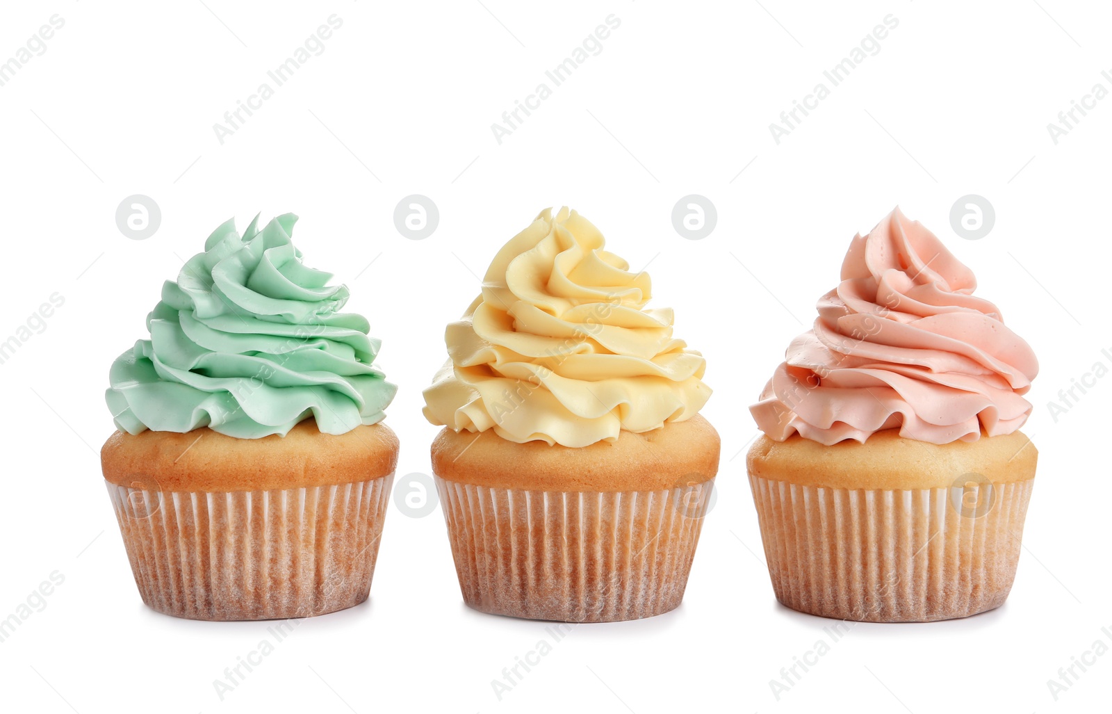 Photo of Delicious cupcakes with cream on white background