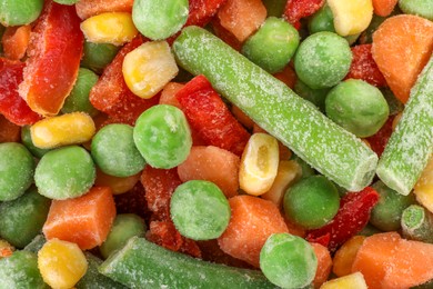 Mix of different frozen vegetables as background, top view