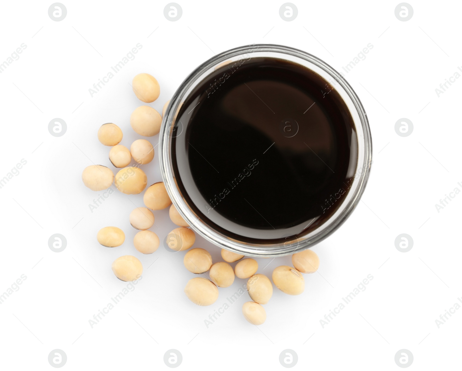 Photo of Bowl of tasty soy sauce and beans isolated on white, top view