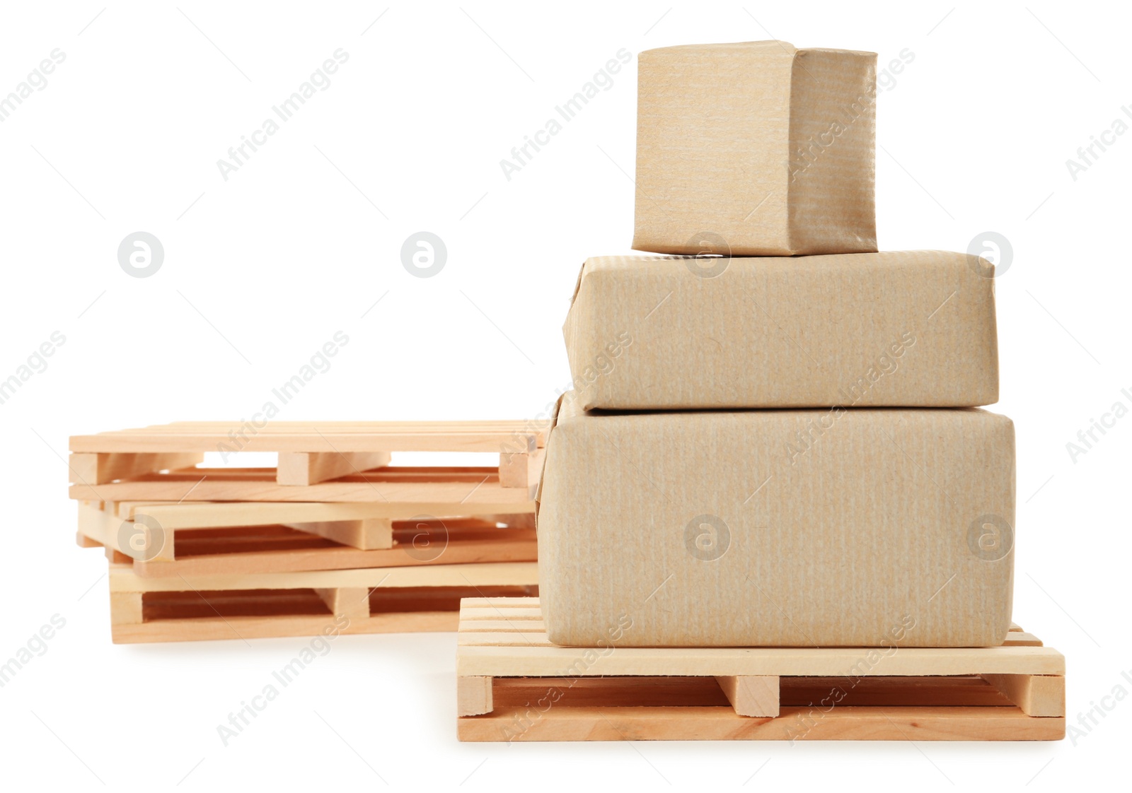 Photo of Small wooden pallets and boxes on white background