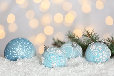 Christmas decoration on snow against blurred background