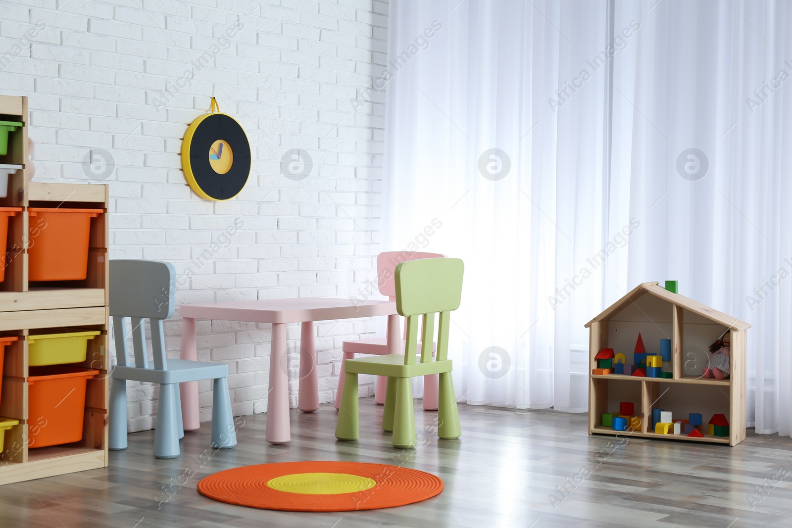 Photo of Modern child room interior with table and chairs