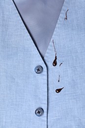 Photo of Dirty vest with drops of chocolate, top view