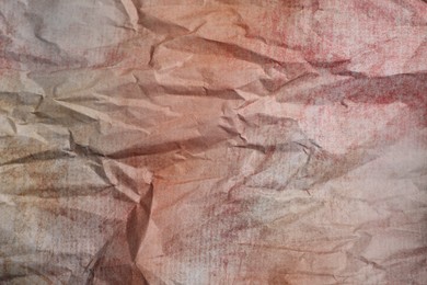 Photo of Texture of crumpled parchment paper as background, top view