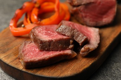 Photo of Delicious grilled beef steak on table, closeup
