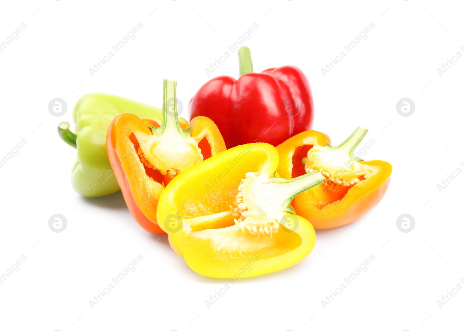 Photo of Whole and cut bell peppers on white background