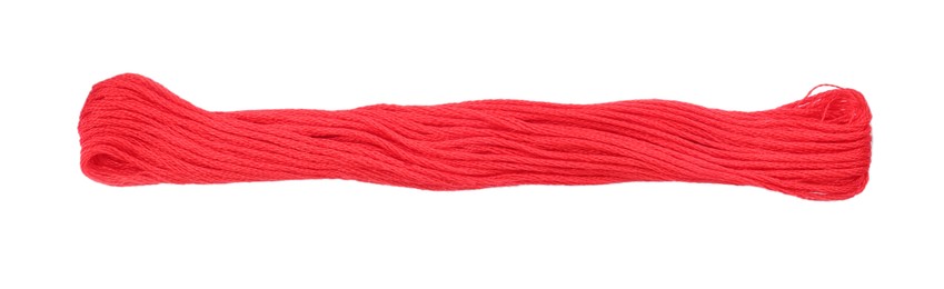 Photo of Light crimson embroidery thread on white background