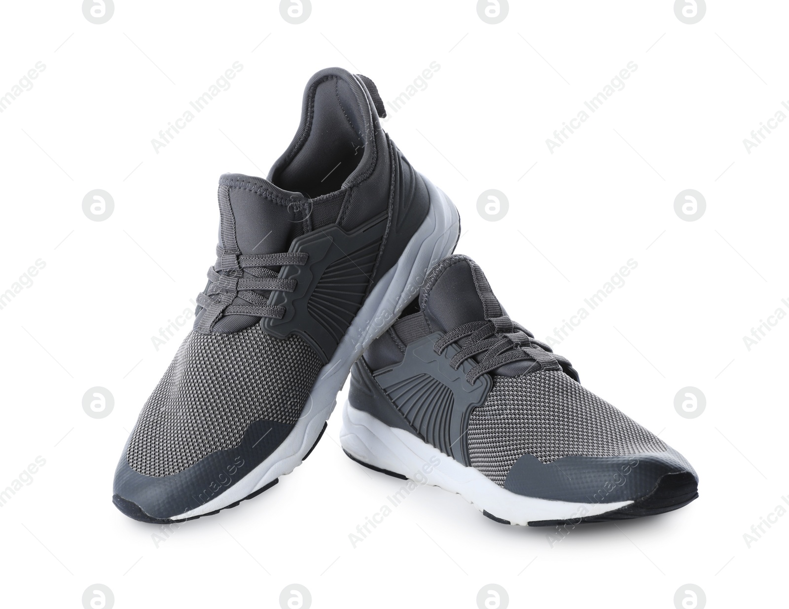 Photo of Pair of stylish grey sneakers on white background