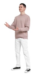 Handsome young man greeting someone on white background