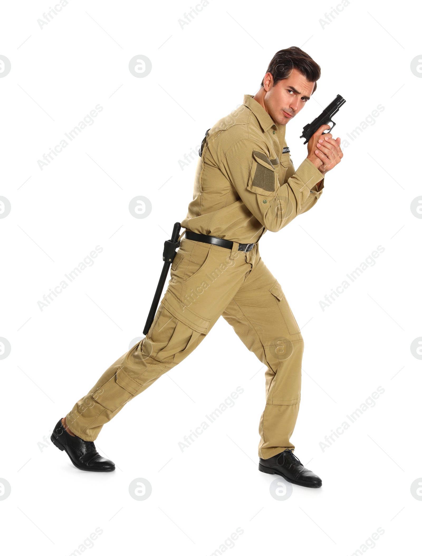 Photo of Male security guard in uniform with gun on white background