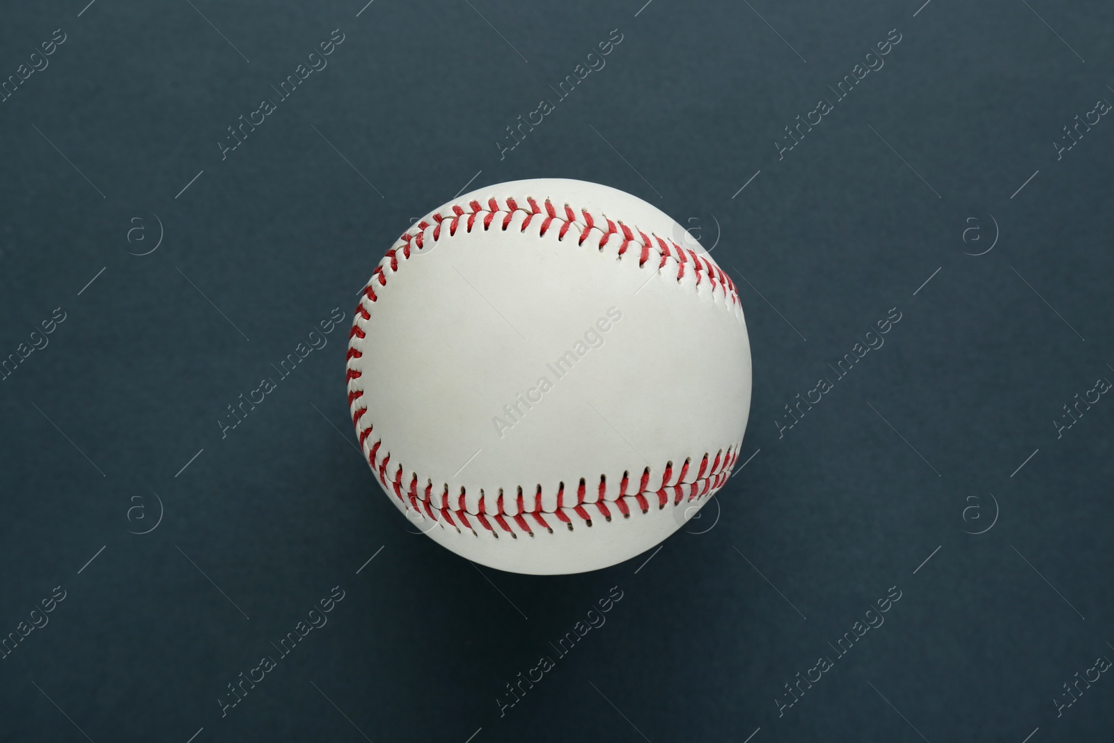 Photo of Baseball ball on dark background, top view. Sports game