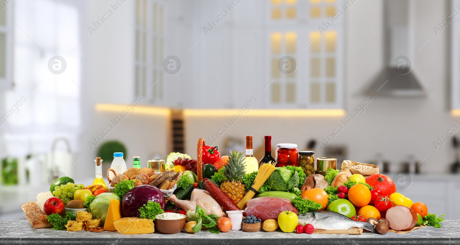 Image of Different products on wooden table in kitchen. Healthy food and balanced diet