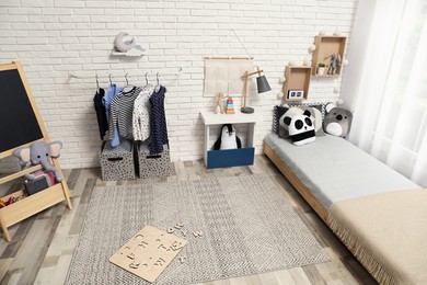 Montessori bedroom interior with floor bed and toys