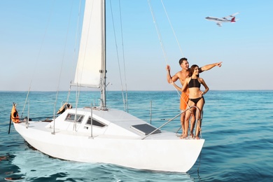 Image of Couple on yacht and airplane in sky over sea. Summer vacation