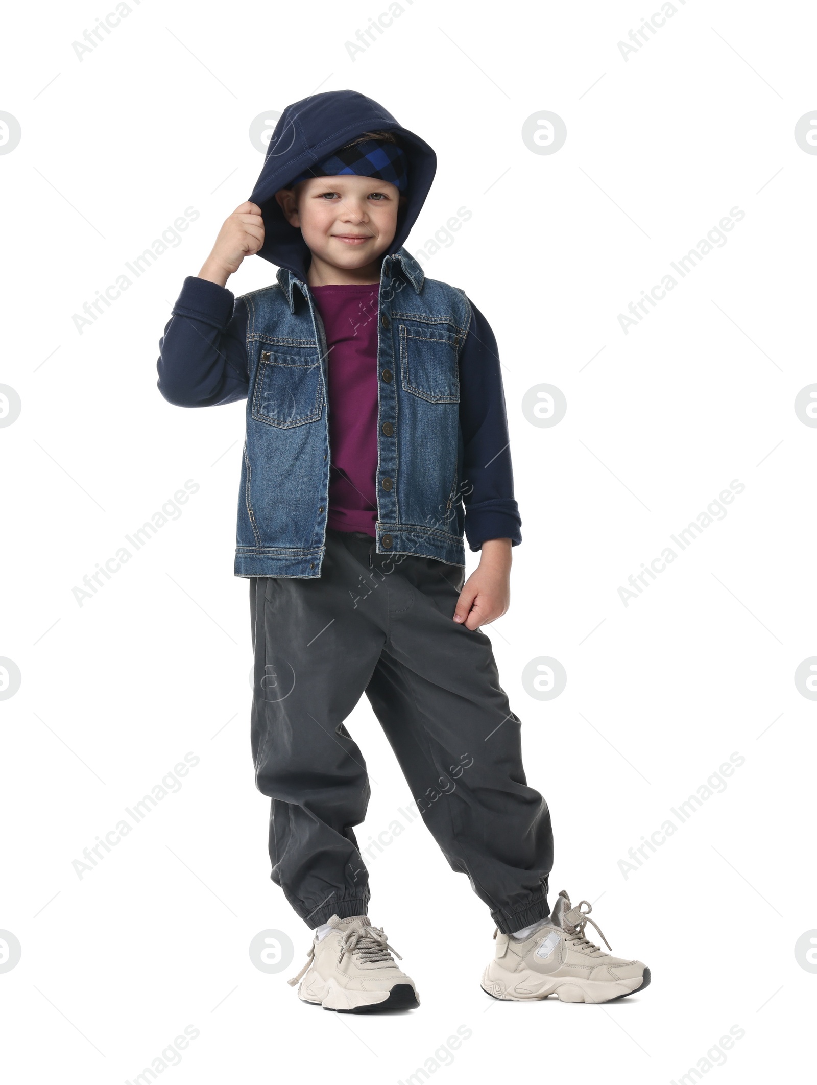 Photo of Happy little boy dancing on white background