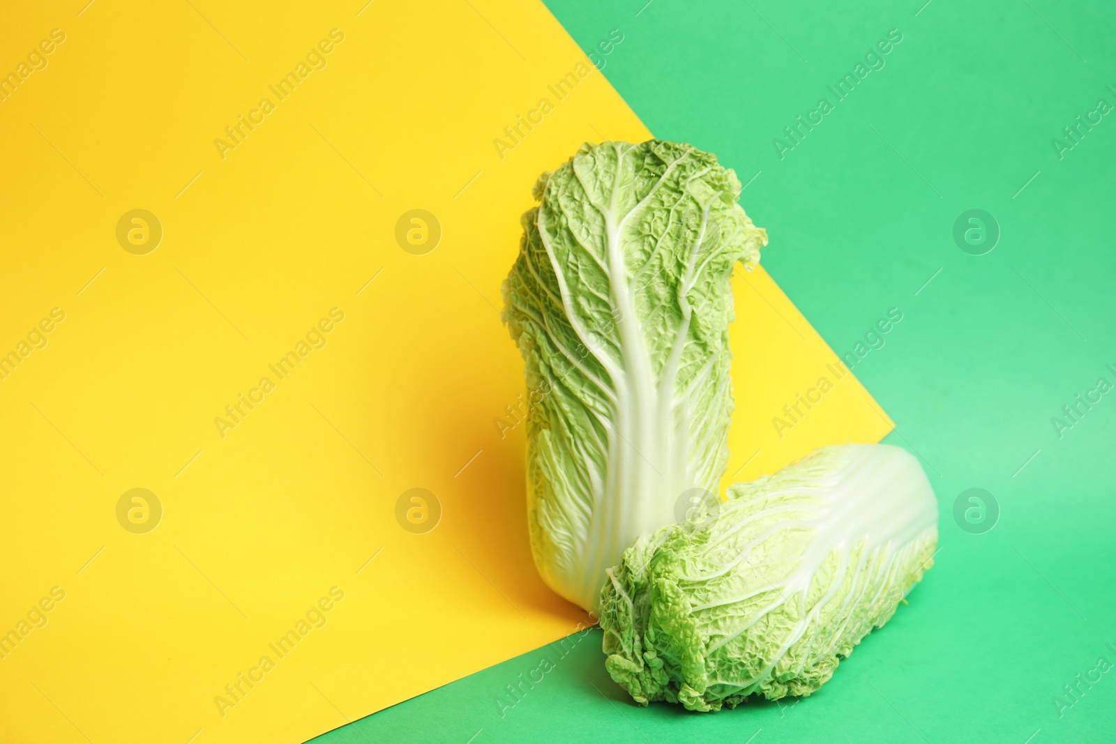 Photo of Fresh ripe cabbages on color background