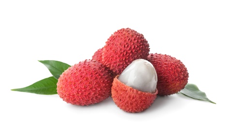 Photo of Pile of fresh ripe lychees with green leaves on white background