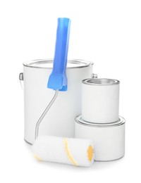 Photo of Paint cans and roller on white background