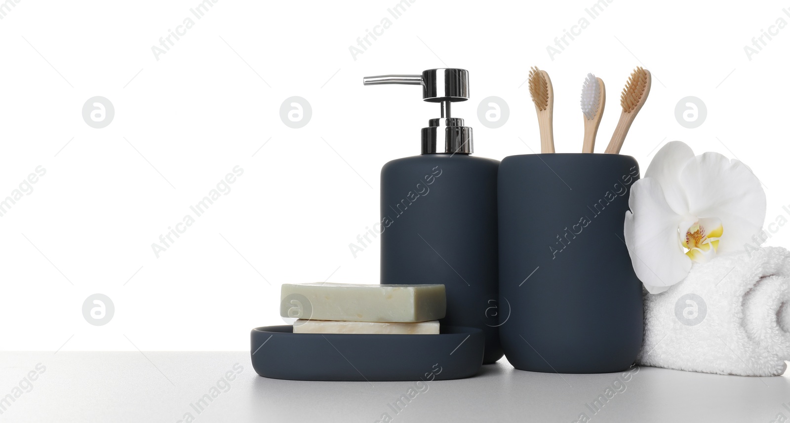 Photo of Bath accessories. Different personal care products and flower on table against white background. Space for text