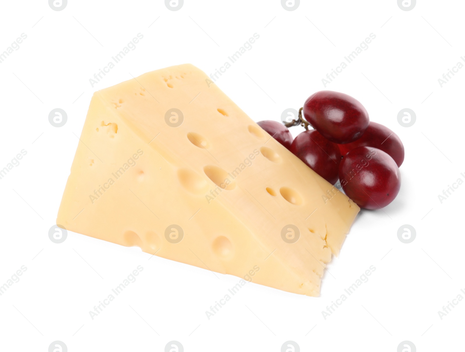 Photo of Piece of delicious cheese and grapes isolated on white