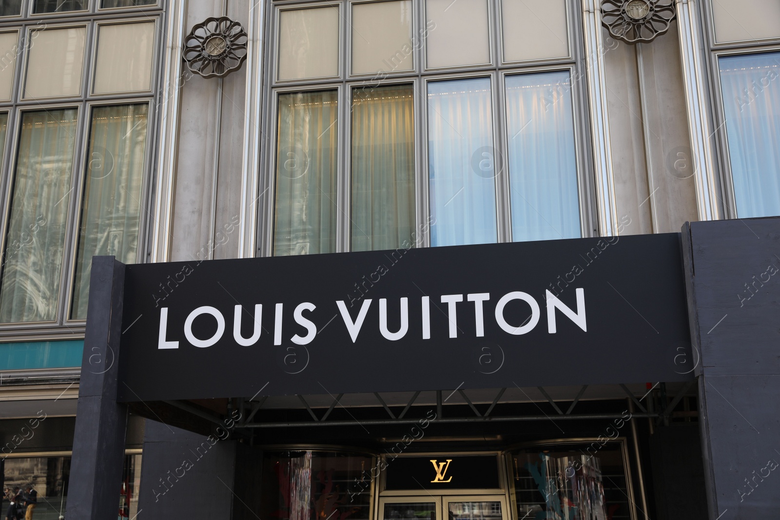 Photo of Cologne, Germany - August 28, 2022: Entrance of Louis Vuitton fashion store outdoors