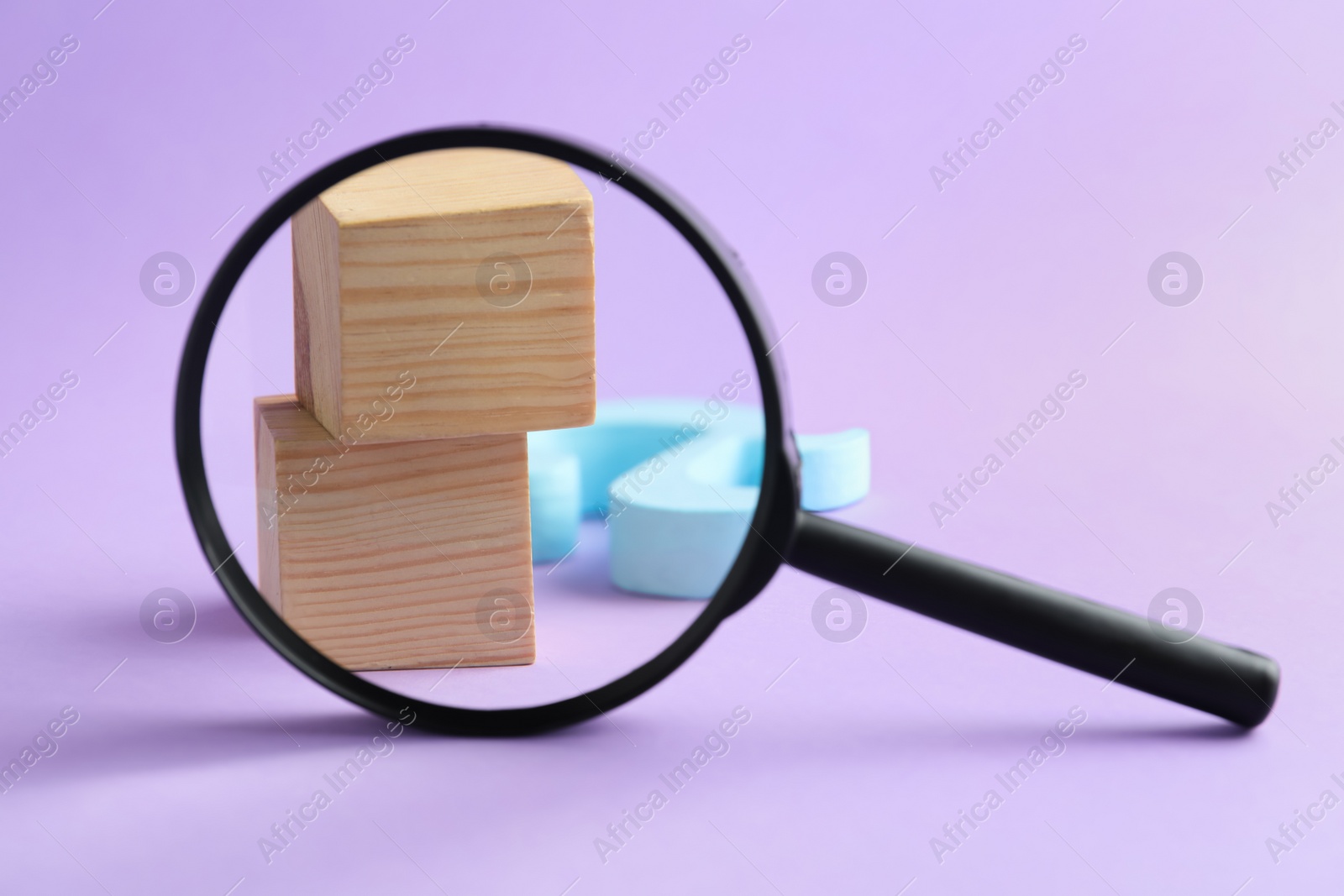 Photo of Magnifier glass, wooden cubes and letter A on violet background, closeup. Find keywords concept