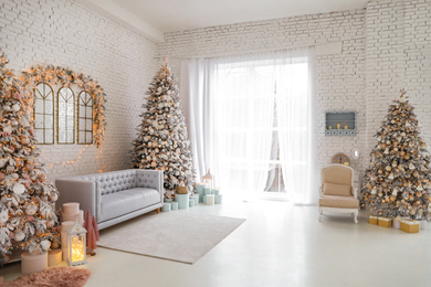 Beautiful interior of living room with decorated Christmas trees