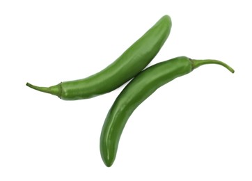 Photo of Green hot chili peppers on white background, top view