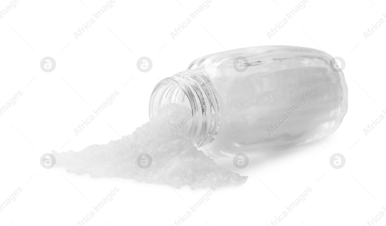 Photo of Natural salt in shaker isolated on white