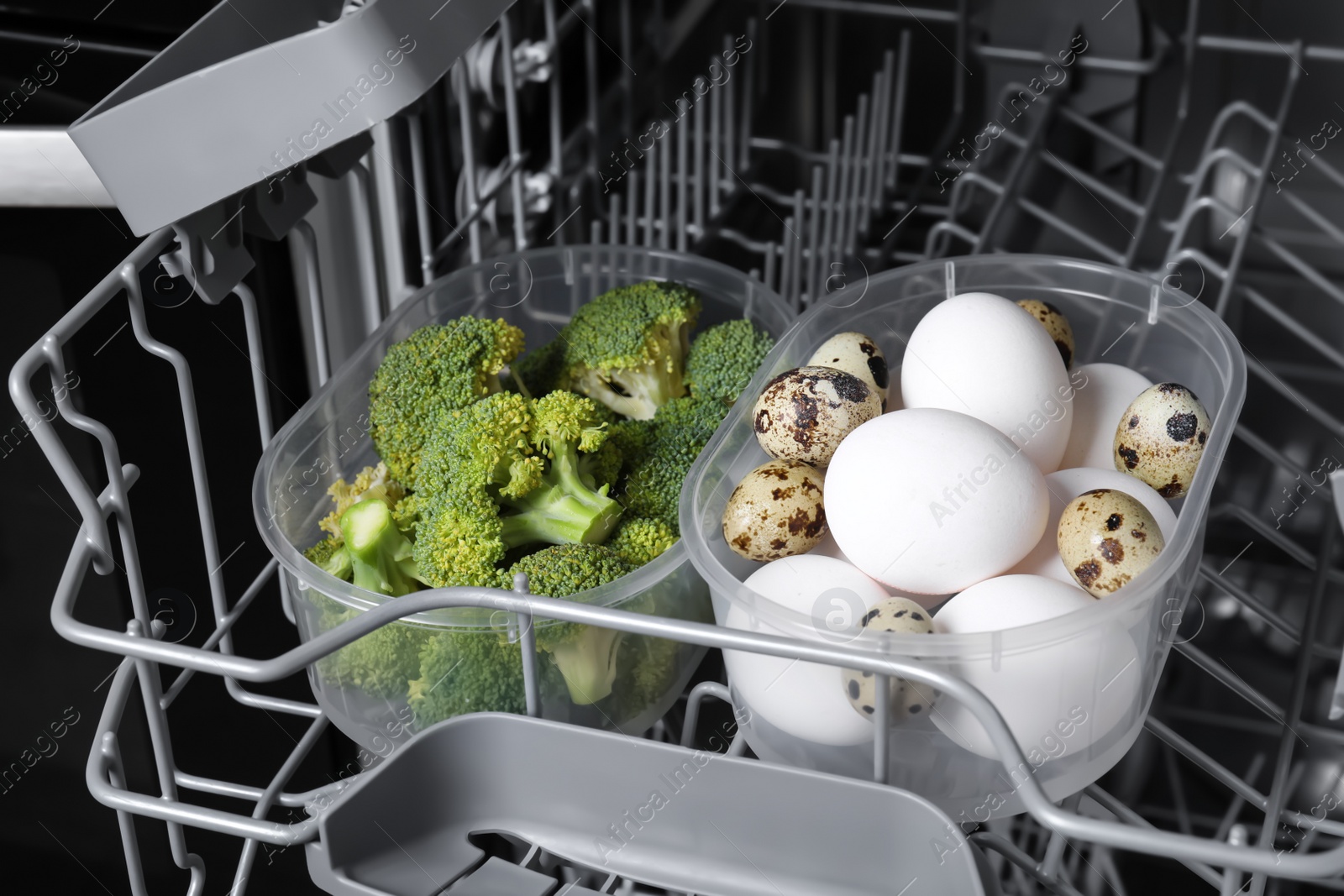 Photo of Cooking raw broccoli and eggs in modern dishwasher, closeup