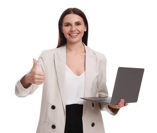 Beautiful businesswoman in suit with laptop showing thumbs up on white background