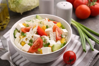 Tasty salad with Chinese cabbage served on table