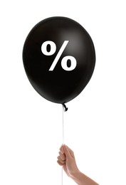 Discount offer. Woman holding black balloon with percent sign on white background, closeup