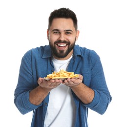 Young man with French fries on white background