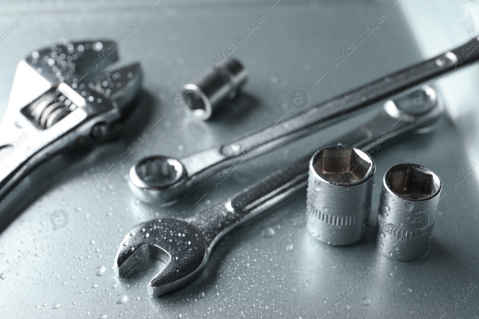 Photo of Auto mechanic's tools on metallic surface, closeup