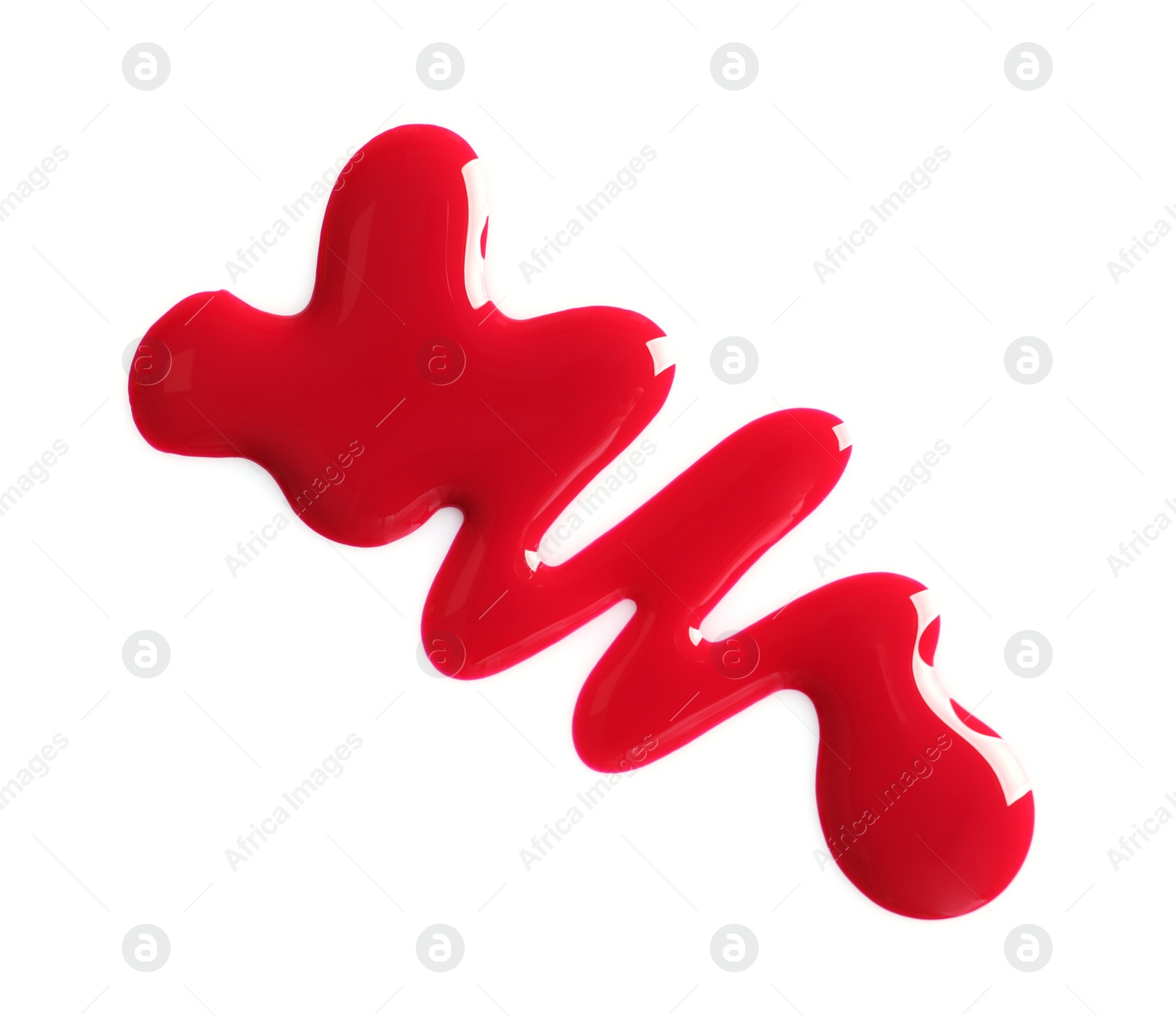 Photo of Spilled bright nail polish on white background, top view