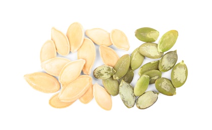 Photo of Pile of raw pumpkin seeds on white background, top view