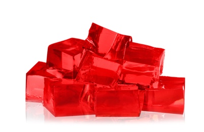 Photo of Heap of red jelly cubes on white background