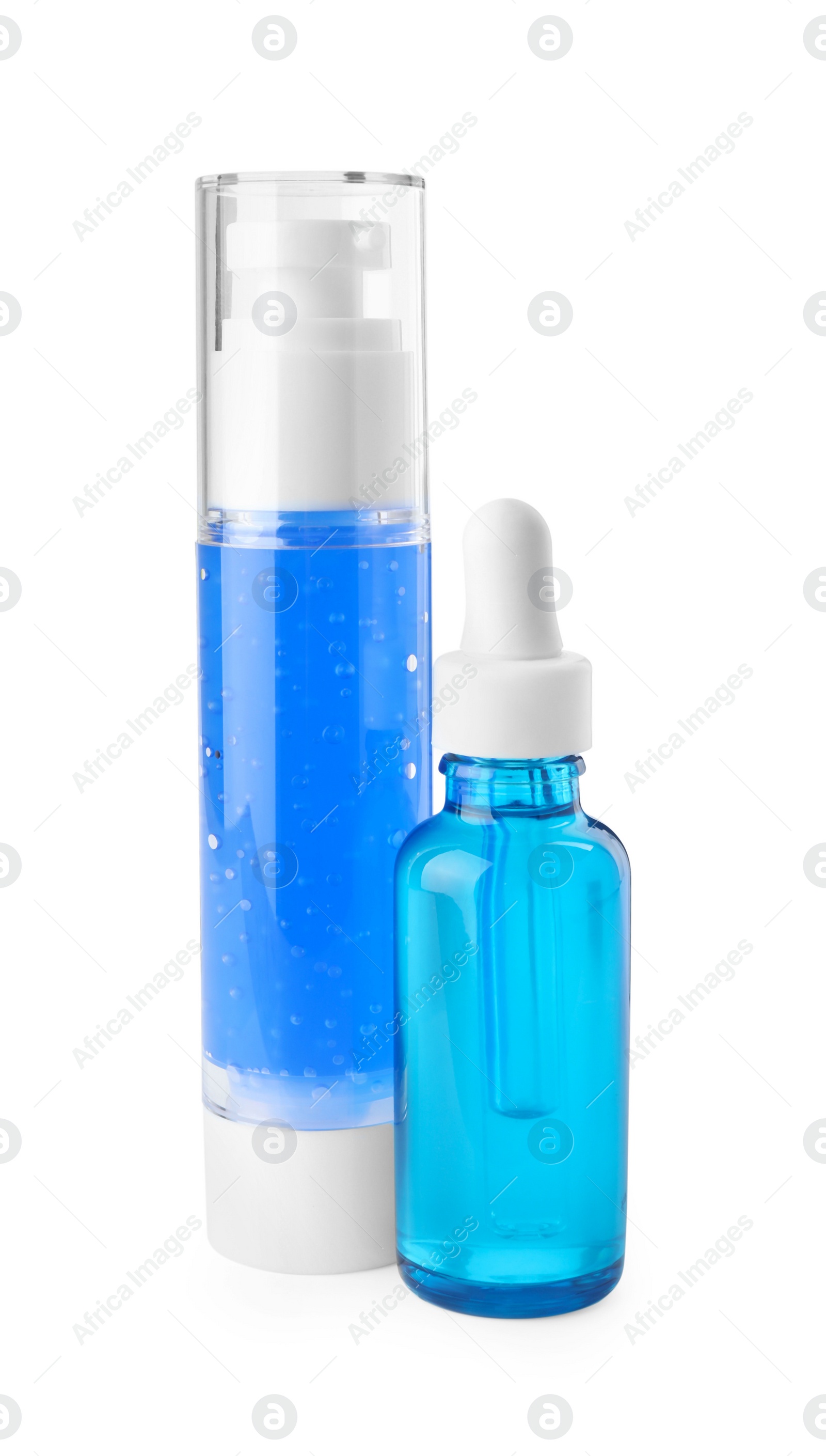 Photo of Bottles of cosmetic products isolated on white