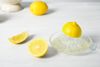 Photo of Slices of lemon and juicer on light table